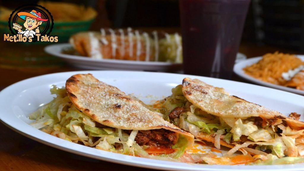 Crunchy Takos · Hard shell tortilla, choice of meat, lettuce, pico, sour cream and parmesan cheese.