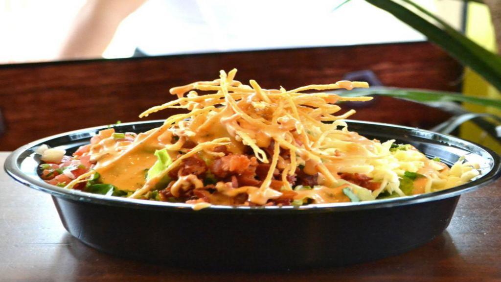 Flakos Salad · Lettuce, pico, tortilla strips, choice of meat, bacon and cheese.