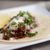 Shredded Beef · Cotija cheese, cilantro, chopped onions.