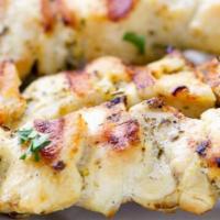 Chicken Skewers With Two Sides · Two all-white meat chicken tender skewers.  Comes with one side and toasted pita bread.