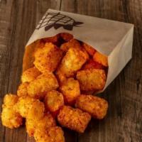 Spiced Tots · Premium Tots tossed in Carnitas Seasoning