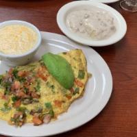 Spanish Omelet · Fresh tomatoes, green onions, bell peppers, jalapeños and jack cheese, topped with avocado a...