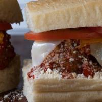 Meatball Hero · Meatballs, mozzarella, parmesan, cheddar, tomato, marinara sauce, butter, oil and vinegar - ...