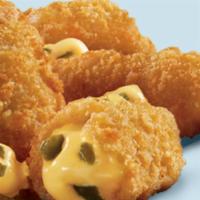 Jalapeño Poppers · Golden brown poppers stuffed with diced jalapeños and Cheddar cheese. Comes with side of ran...