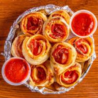 Pep Roll Ups · House-made dough, 100% whole milk mozzarella and pepperoni. Brushed with olive oil and sprin...