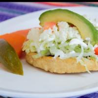 Sope · A handmade corn fritter topped with your choice of meat, refried beans, lettuce, tomato, avo...