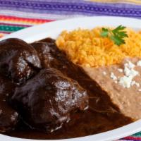 Mole Oaxaqueno · Home made chocolate based sauce with different types of chiles, served with chicken, rice an...