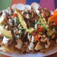 Home Style Nacho · Served with your choice of meat, beans, cheese, tomato, avocado, sour cream, onions, cilantr...
