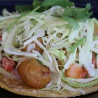 Beer Battered Shrimp Taco · Ensenada-style with creamy lime, pico & cabbage