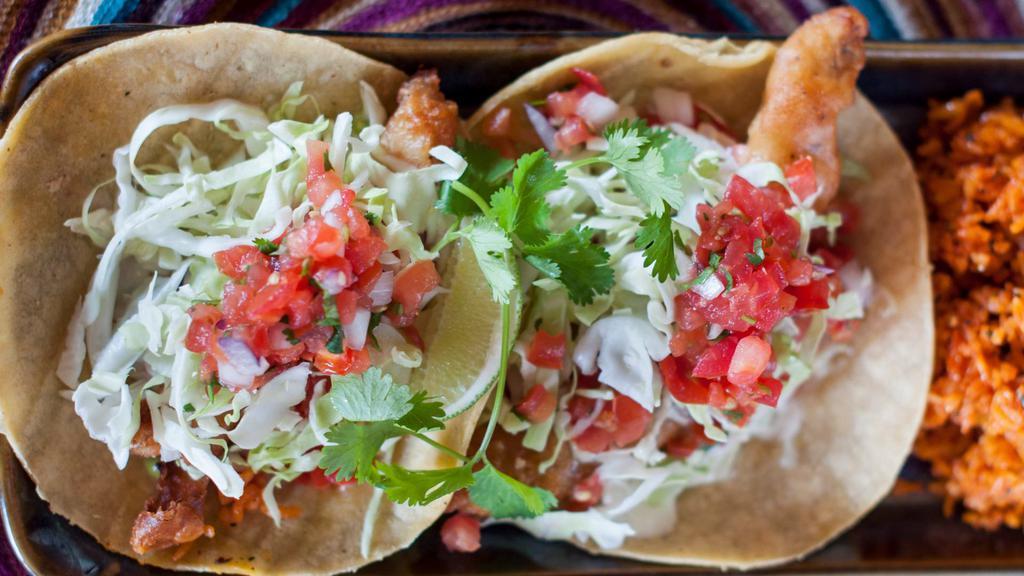 Ensenada Style Fish Tacos (2) · crispy fish, lime sauce, pico, cabbage, avocado sauce