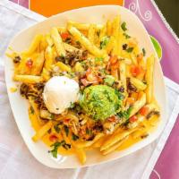 Carne Asada Fries · Fries, carne asada, cheese, sour cream, guacamole and fresh salsa.