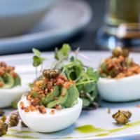 Deviled Eggs. · Spinach and basil flavored deviled eggs, topped with. crispy bacon & crispy capers