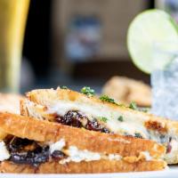 Goat Cheese & Onion Jam Grilled Cheese · Mozzarella, goat cheese, and homemade onion jam on buttered sliced country bread