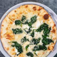 Pizza Three Cheese And Spinach · Garlic spread, mozzarella, goat cheese, parmesan, spinach