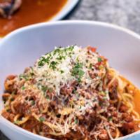 Spaghetti Bolognese · Spaghetti tossed in classic meat sauce