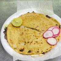 Mulita · 2 big handmade tortillas, cilantro, onion, cheese, and guac 🥑