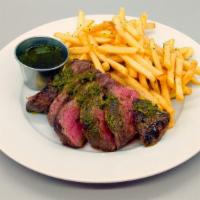 Steak Frites · 8 oz. Flat-iron steak with classic French fries and chimichurri sauce.