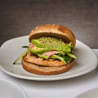 Sushi Salmon Burger · Nori, wasabi-mayo, ginger, cucumber, avocado, and sprinkle of sesame seed on top. Served on ...