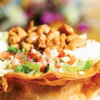 Tostada Salad · Rice, beans, lettuce, cheese, sour cream pico de gallo, and any meat.