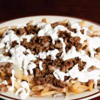 Asada Fries · Fries beans, Jack cheese, sour cream, and any meat.