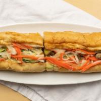 Char-Grilled Pork · grilled pork serve with french baguette, house mayo, pickled carrots and radish, cucumber, c...