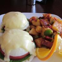 Eggs Benedict · Canadian bacon, poached eggs over English muffin topped with hollandaise sauce.