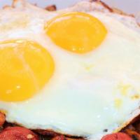 Louisiana Hash · Heavenly mix of our home-style potatoes with spicy Louisiana style sausage. Topped with sunn...