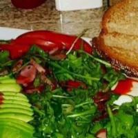 Breakfast Salad · Fresh organic arugula tossed with sauteed Canadian bacon, red onions, fresh lemon & herbs dr...