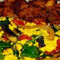 Vegan Scrambled · Organic tofu scrambled with sweet peppers, sun dried tomatoes, portobello mushrooms, red oni...