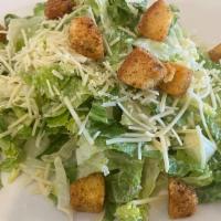 Caesar Salad · Crisp romaine lettuce topped with garlic croutons, parmesan cheese, and Caesar dressing.
