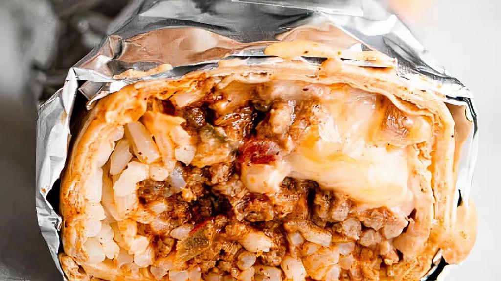 Giant Lunch Burrito · All burritos are made with Spanish rice, refried beans, cheddar cheese, & meat. No substitutions or withholding of ingredients.