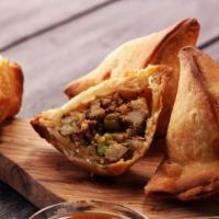 Samosa Vegetables · Crispy puffs stuffed with potatoes and green peas.