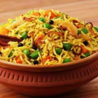 Vegetable Biryani · Aromatic rice dish made with basmati rice, traditional spices & mixed veggies.