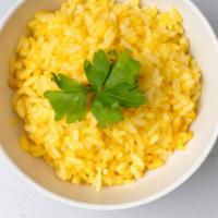 Saffron Rice · Indian basmati rice with saffron, nuts, and raisins.