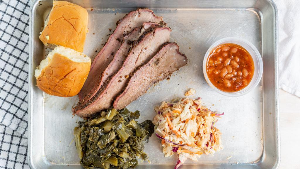 Tri Tip Dinner · Smoked slices of beef tri tip so tender and juicy. Comes with two sides. Please specify in note. Choices are macaroni and cheese, collard greens, potato salad or smoked baked beans. Bread and BBQ sauce included.