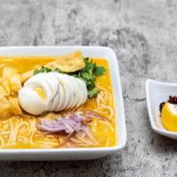 Coconut Chicken Noodle · Burmese style coconut noodle soup with chicken, onions, eggs, cilantro and lemon.