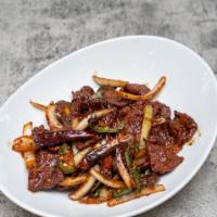 Chili Beef · Chef's choice. Slices of beef tossed with chili sauce, garlic, onion, basil, jalapeños and c...