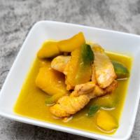 Pumpkin Salmon Curry · Tender squash stew cooked with salmon, onions, garlic and ginger.