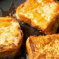 French Toast · Three slices of thick sliced bread in our own batter, served with butter and warm maple syrup.