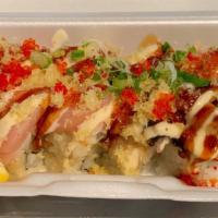 Crunchy Rainbow Roll · (Tempura Shrimp & Avocado roll) Topped with Assorted Sashimi & sprinkled with Tobiko