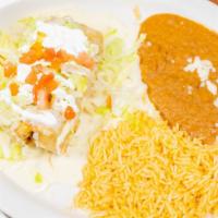 Chimichanga · Stuffed with your choice of meat, bell peppers and onions. Topped with cheese dip, lettuce, ...