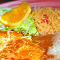 Huevos Rancheros · Two eggs over easy with ranchera sauce topped with cheese, rice and beans.