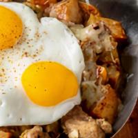 Chile Verde Skillet · Authentic Chile Verde over diced potatoes and two eggs with sour cream. Served with your cho...
