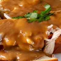 Roasted Breast Of Turkey · House-roasted turkey breast served open-faced with gravy and homemade mashed potatoes.
