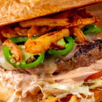 Jalapeno Burger · Topped with sauteed jalapenos, pepper jack cheese, and crispy onion tangles.