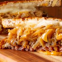 The Melt Burger · Traditional patty melt with melted cheese and sauteed onions on grilled rye bread. (No produ...
