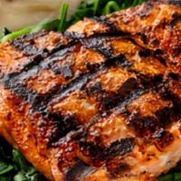 Wild Grilled Alaskan Salmon · Slightly spicy seasoning served on a bed of sauteed spinach with your choice of side. (Serve...