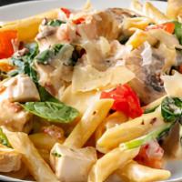Chicken Alfredo · Penne pasta and grilled chicken breast tossed with fresh mushrooms, spinach, and diced tomat...