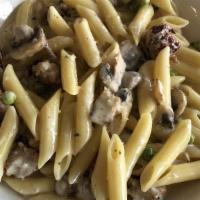 Penne Alla Boscaiola · Penne pasta with chicken sausage. Served with peas, mushroom and chicken sausage in cream sa...