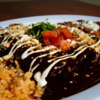 Enchilada Plate · Three enchiladas with choice of one filling beef, chicken, cheese or vegetarian, queso fresc...
